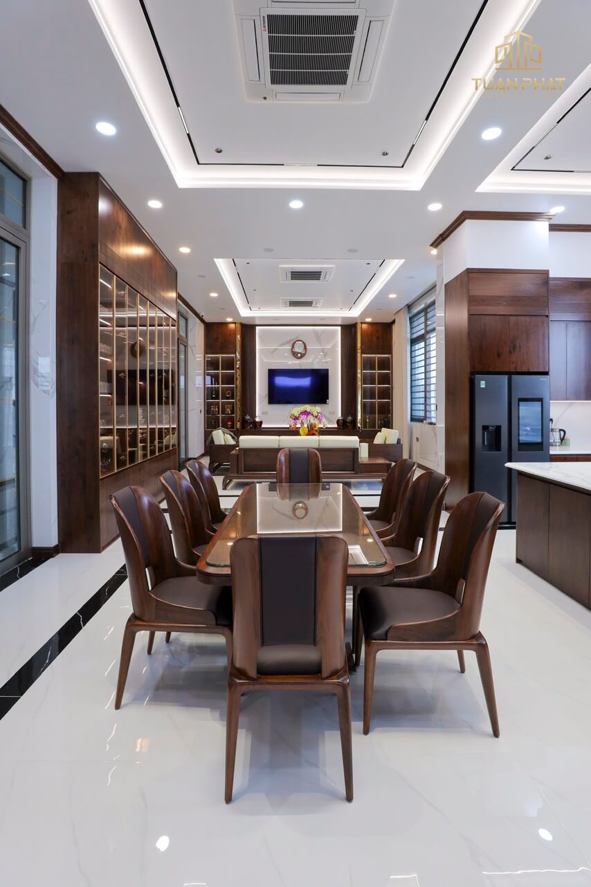 Phòng ăn thông phòng khách gỗ óc chó Cần Thơ